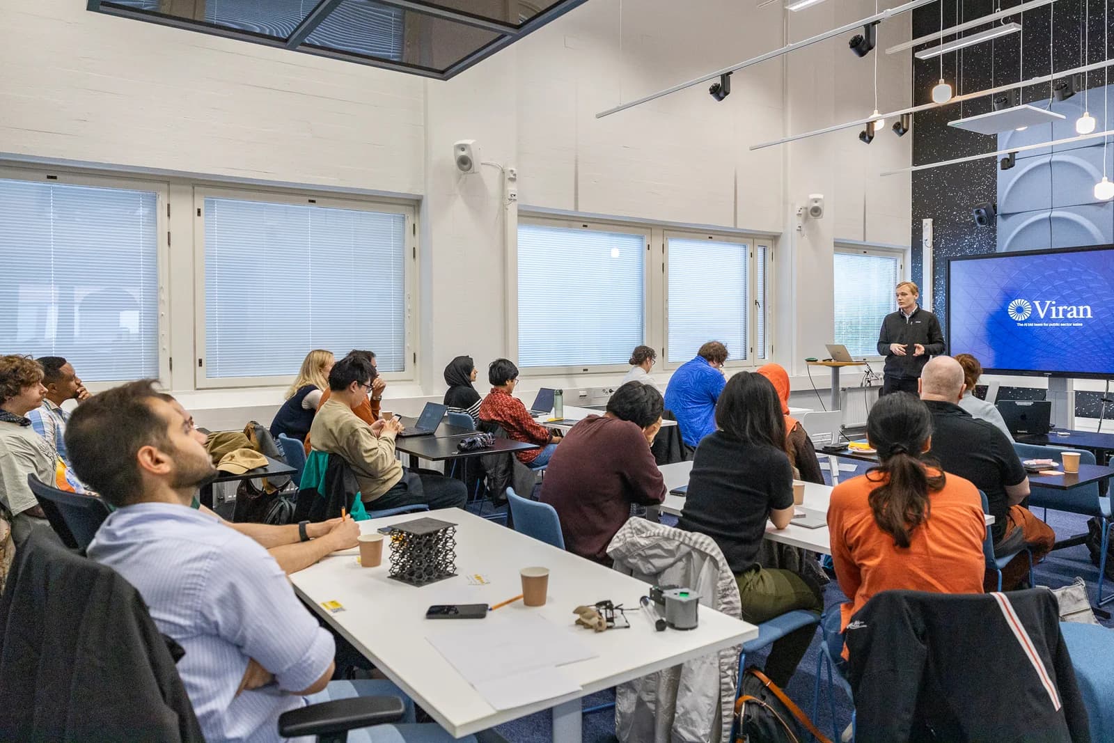 Aaro Angerpuro speaking to the Aalto Inventors cohort in a classroom